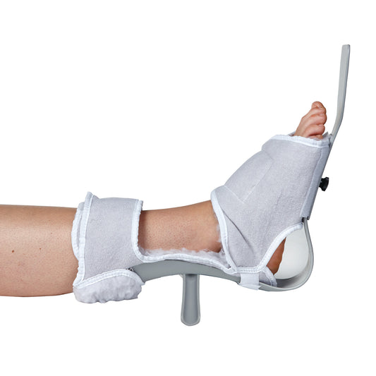 A leg wearing the AliMed MultiBoot Standard Contracture Boot, featuring a padded gray design with a supportive plastic frame.