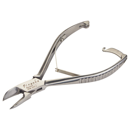 A stainless steel nail cutter, labeled "Piranha," with curved handles and sharp blades, designed for precision trimming.
