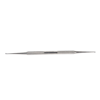 A Double-Ended Curette with a textured grip and pointed ends is shown against a plain white background.