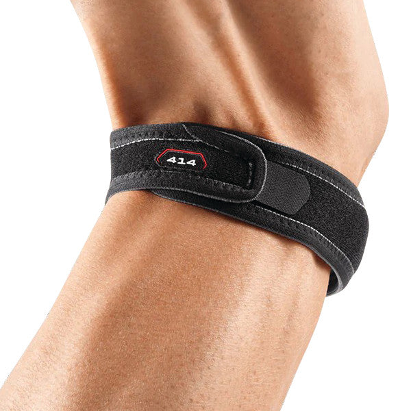A black McDavid Jumper's Knee Strap is wrapped around an arm, featuring the number 414 on it.