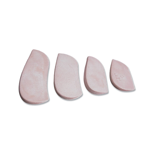 Four pink Molded Rubber Heel Wedges of varying sizes are aligned horizontally on a white background.