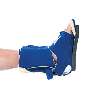 A Comfy Splints Adult Ambulating Contracture Boot is shown on a leg, featuring a blue exterior and a fur-lined interior.