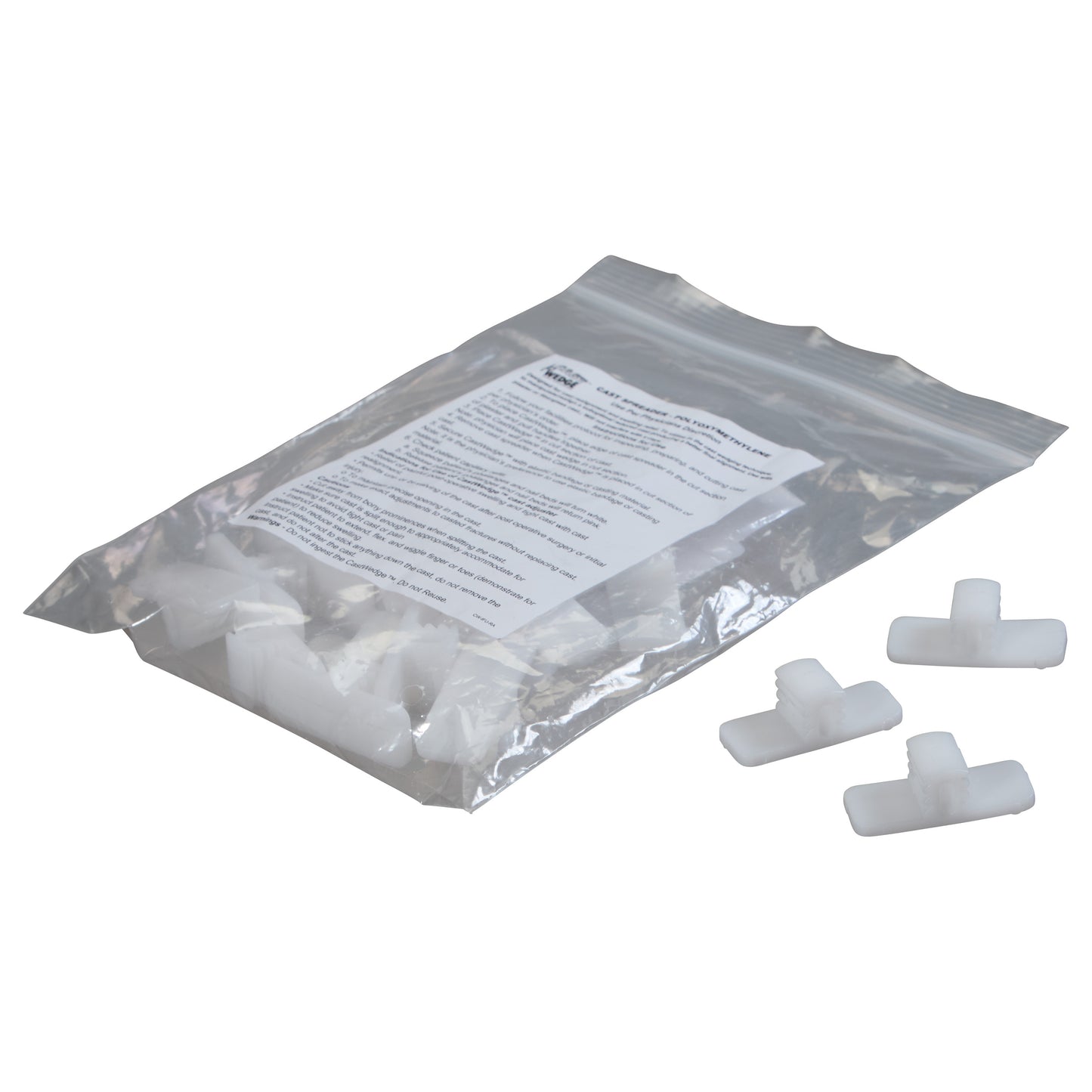 A bag containing several white pieces labeled as "Replacement Wedge for CastWedge Starter Set," with a few wedges outside the bag.