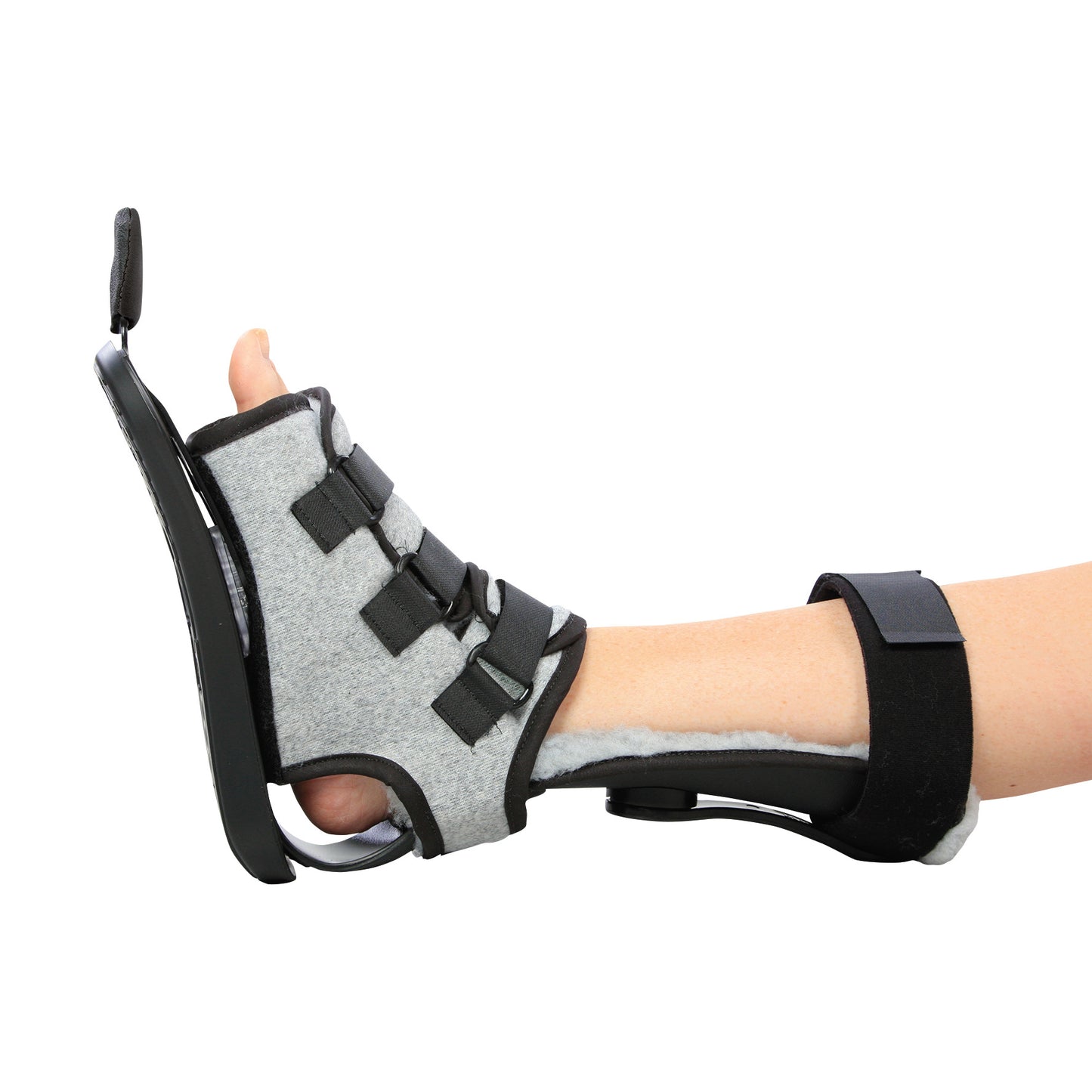 A foot wearing the AliMed MultiBoot X-Cel Contracture Boot with Synthetic Fleece Liner, featuring straps and a supportive frame.