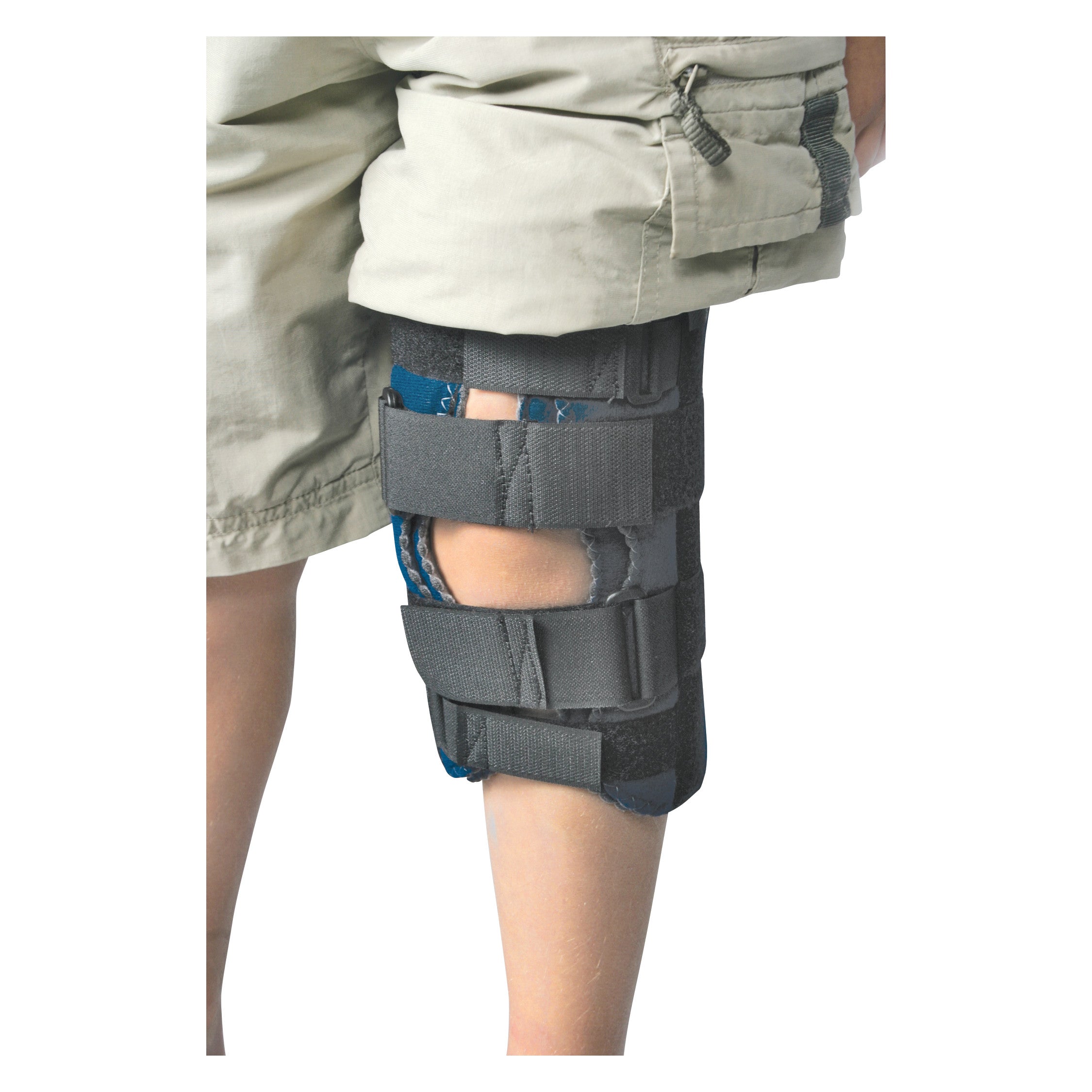 A person wearing the RCAI Knee Immobilizer on their right leg. The brace has multiple adjustable straps and is worn over shorts.