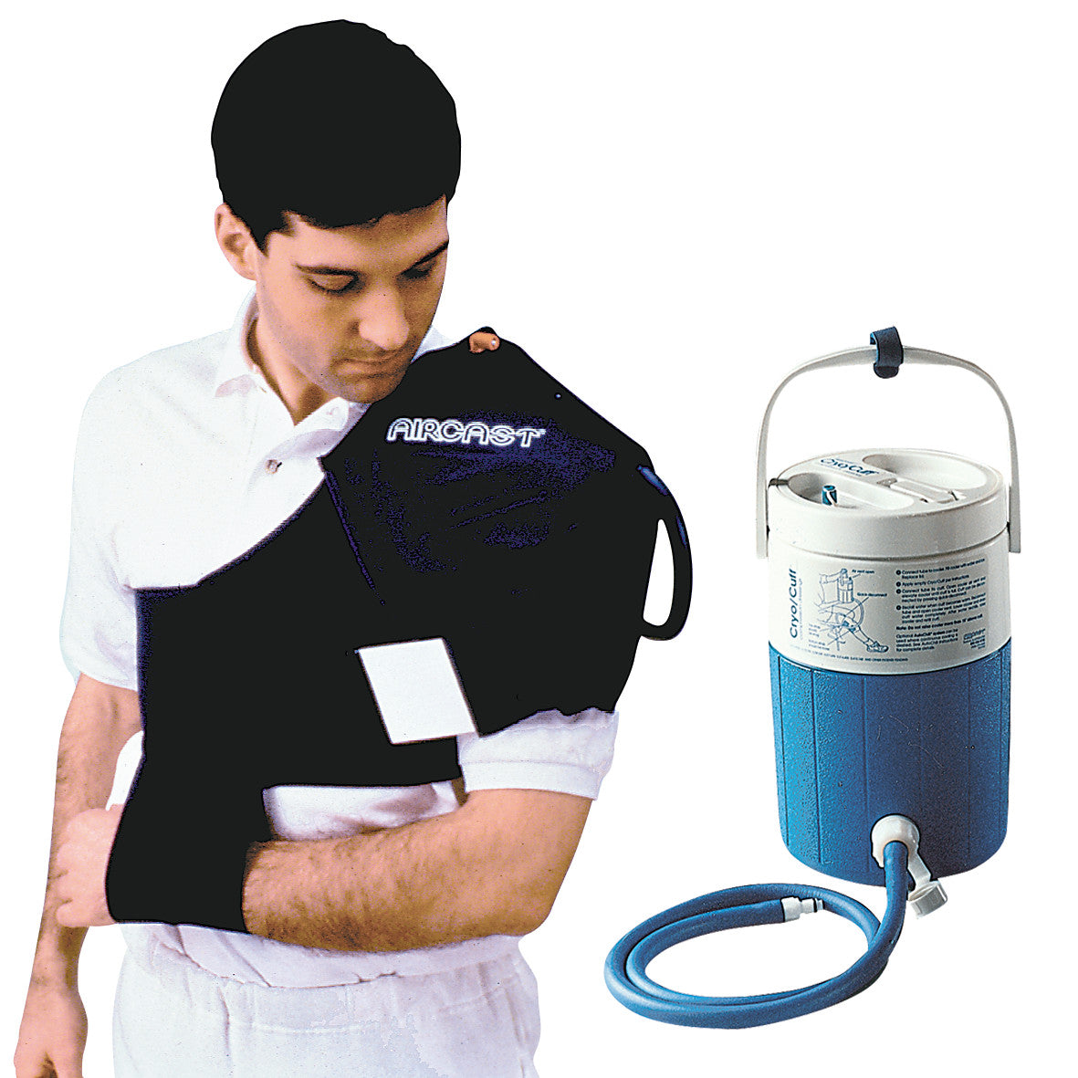 A man wearing an Aircast Cryo/Cuff IC System on his shoulder, next to a blue and white ice therapy cooler with a connecting tube.