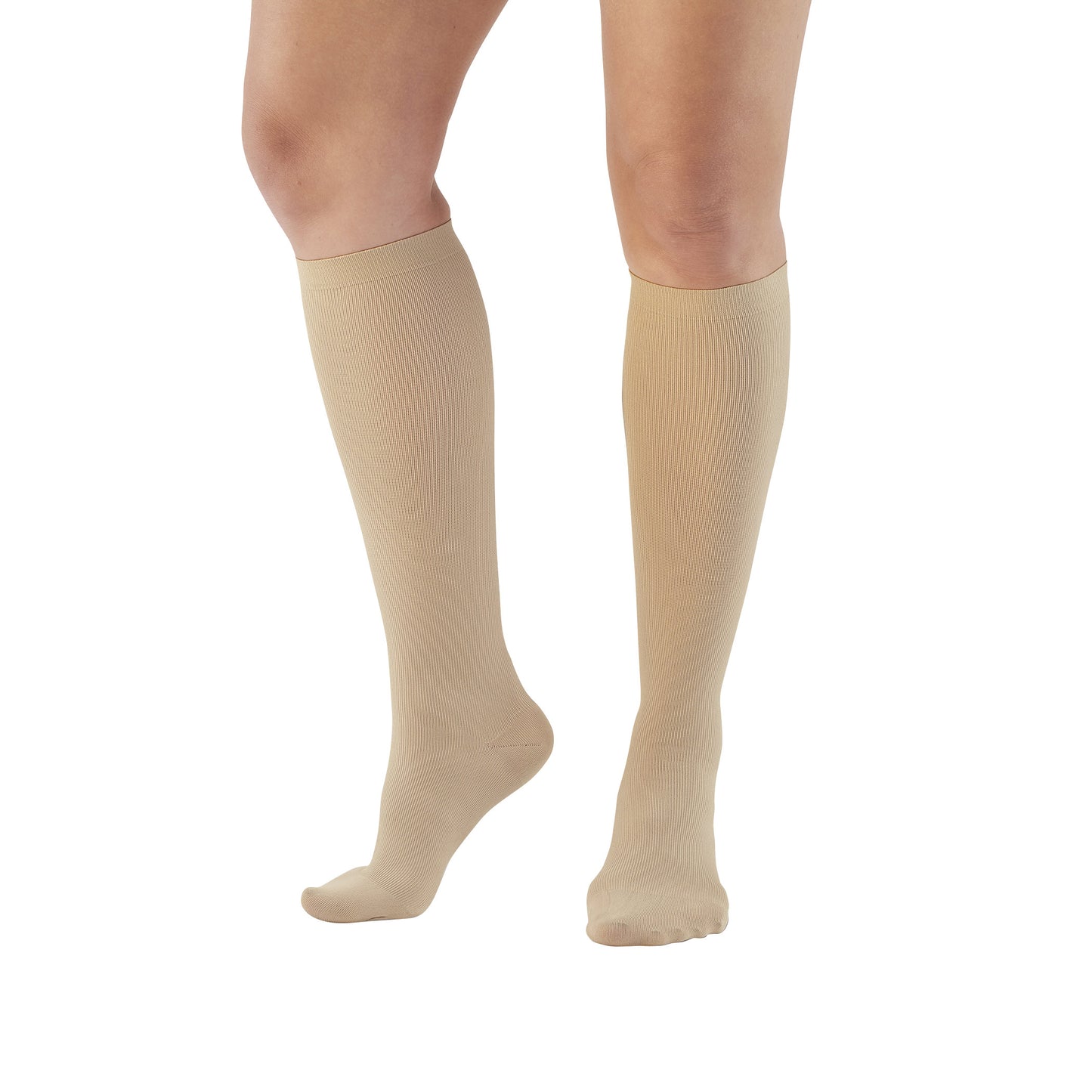 A person wearing Ames Walker Knee-Length Microfiber Support Socks in beige, showing both legs from the knees down.