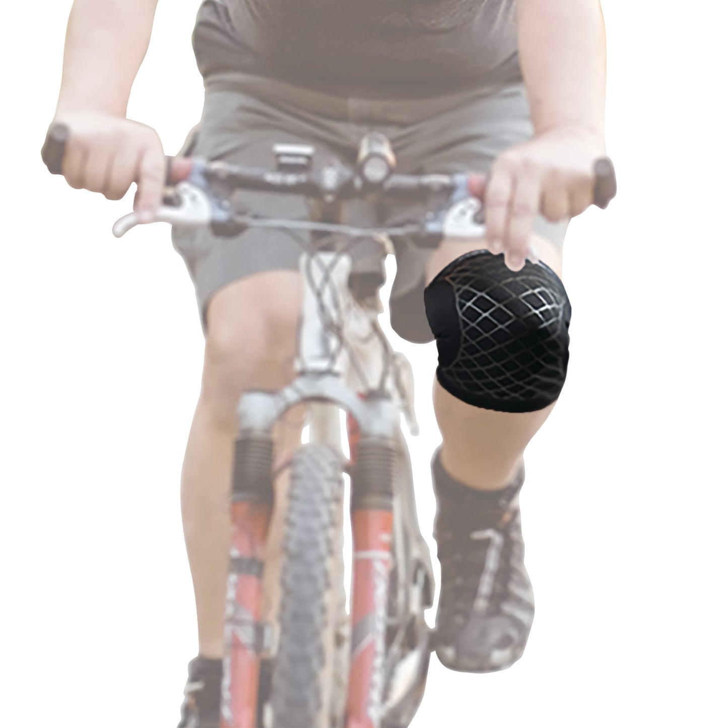 A person rides a bike wearing the Brownmed Spark Kinetic Knee Sleeve, featuring a black design with a mesh pattern.