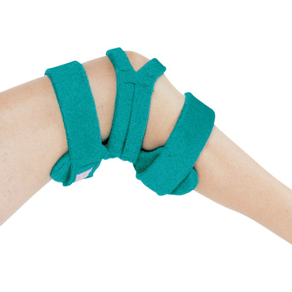 A Comfy Splints Pediatric Spring-Loaded Goniometer Knee Orthosis wraps around a bent knee, featuring adjustable turquoise straps.