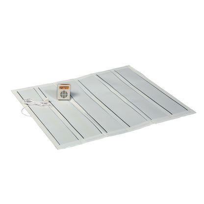 A Wet Call Alarm and Pad with a flat pad featuring black stripes, connected to a small beige alarm box with a cord.