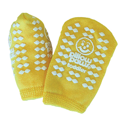 Yellow Pillow Paws Double Print Risk-Alert Socks with white grip patterns and a smiley face logo for toddlers.