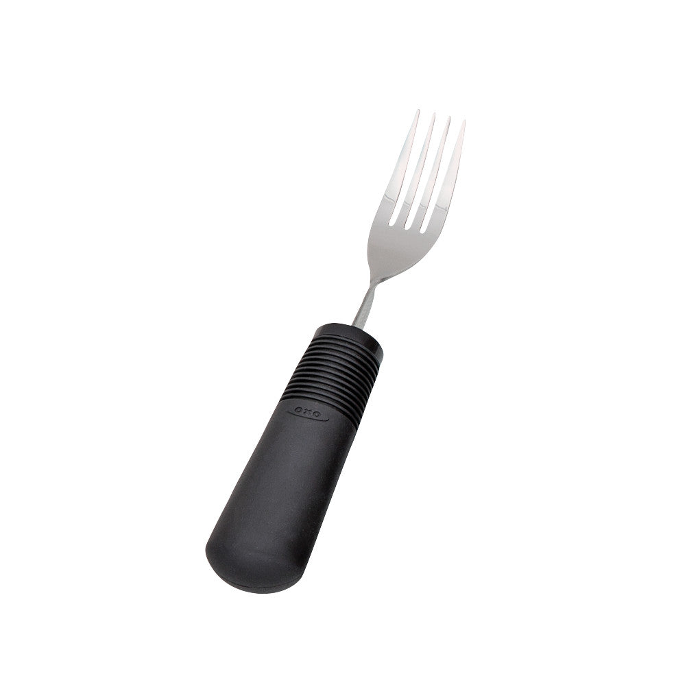 A Good Grips Weighted Utensils fork with a black ergonomic handle and silver tines, designed for easier gripping.