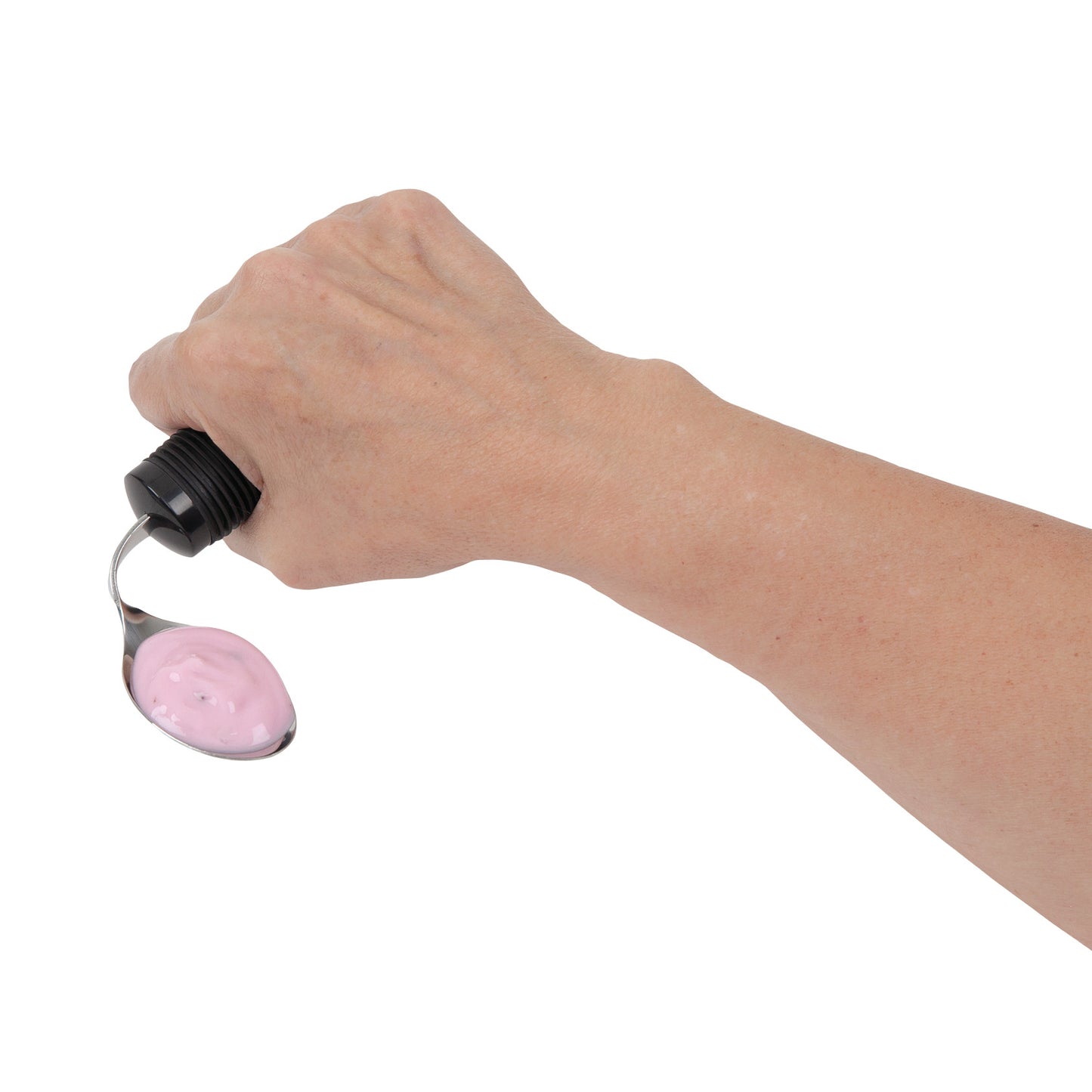 A hand holds a spoon with pink yogurt, featuring the Good Grips Standard Utensils' ergonomic, non-slip black handle.