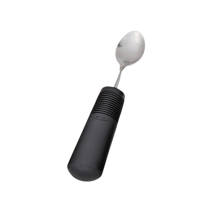 A Good Grips Standard Utensils spoon with a stainless steel head and a black, non-slip, comfortable handle.
