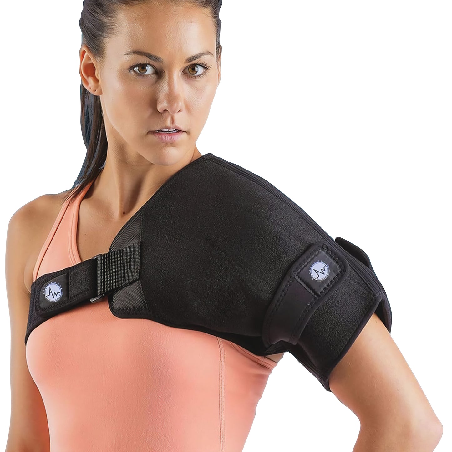 A woman wears an ActiveWrap shoulder support brace. The black brace is secured with adjustable straps over a peach tank top.