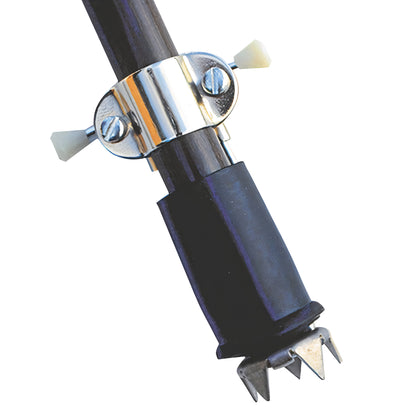 A metal Ice Grip attached to the end of a walking stick, featuring sharp spikes for stability on icy surfaces.