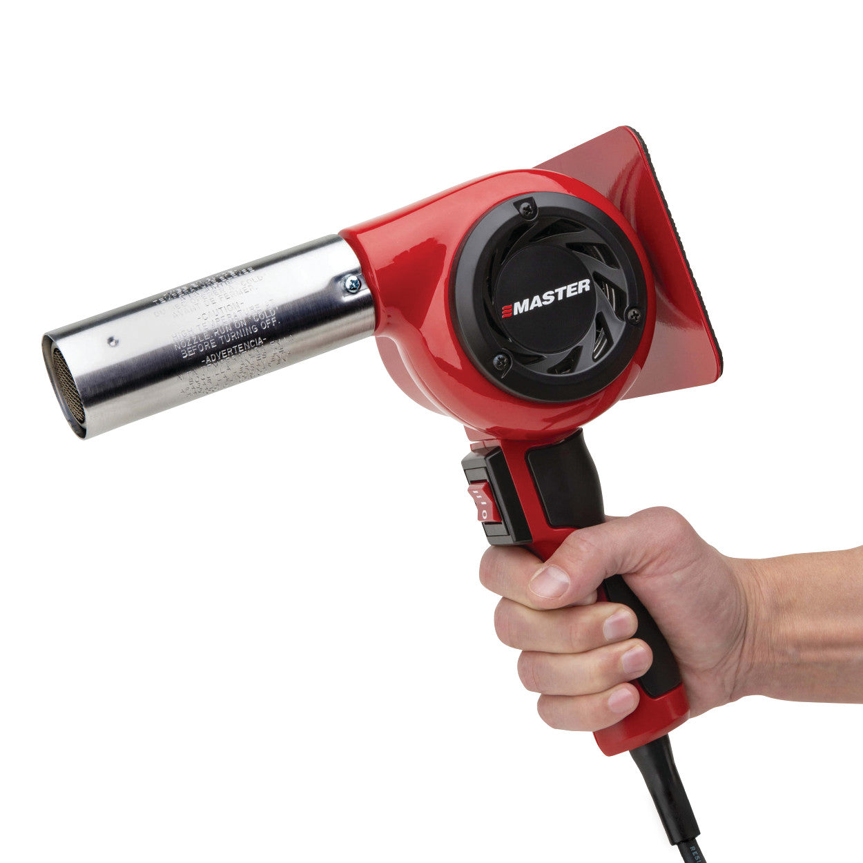 A red Master Heat Gun is held in a hand, showing its black fan and metallic nozzle, with a power cord attached.