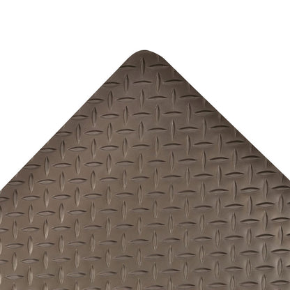 Close-up of the Saddle Trax Anti-Fatigue Mat showing its diamond-patterned surface and rounded corner, in a brown color.