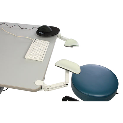 The ErgoRest Articulating Forearm Support is attached to a desk beside a keyboard and mouse, next to a round blue chair.
