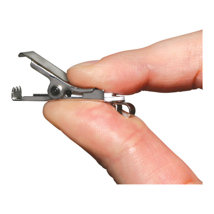 A hand holds a small, metallic Tamper-Resistant Clothing Clip, showing its gripping mechanism.