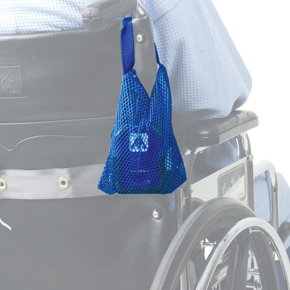 A blue AliMed Alarm Mounting Bag is attached to the handle of a wheelchair, holding a device inside.