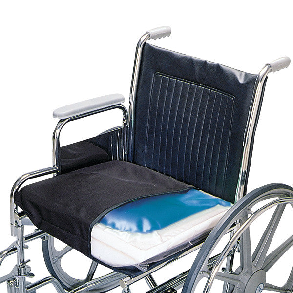 A wheelchair with a SkiL-Care Ultra-Cushion on the seat, featuring a black cover and a visible blue gel section for comfort.