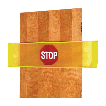 A wooden door with an AliMed Stop Strip featuring a yellow band and a red octagon labeled "STOP" across the middle.