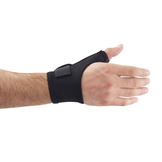 A hand wearing an AliMed FREEDOM Comfort Thumb Wrap in black, providing support around the thumb and wrist.