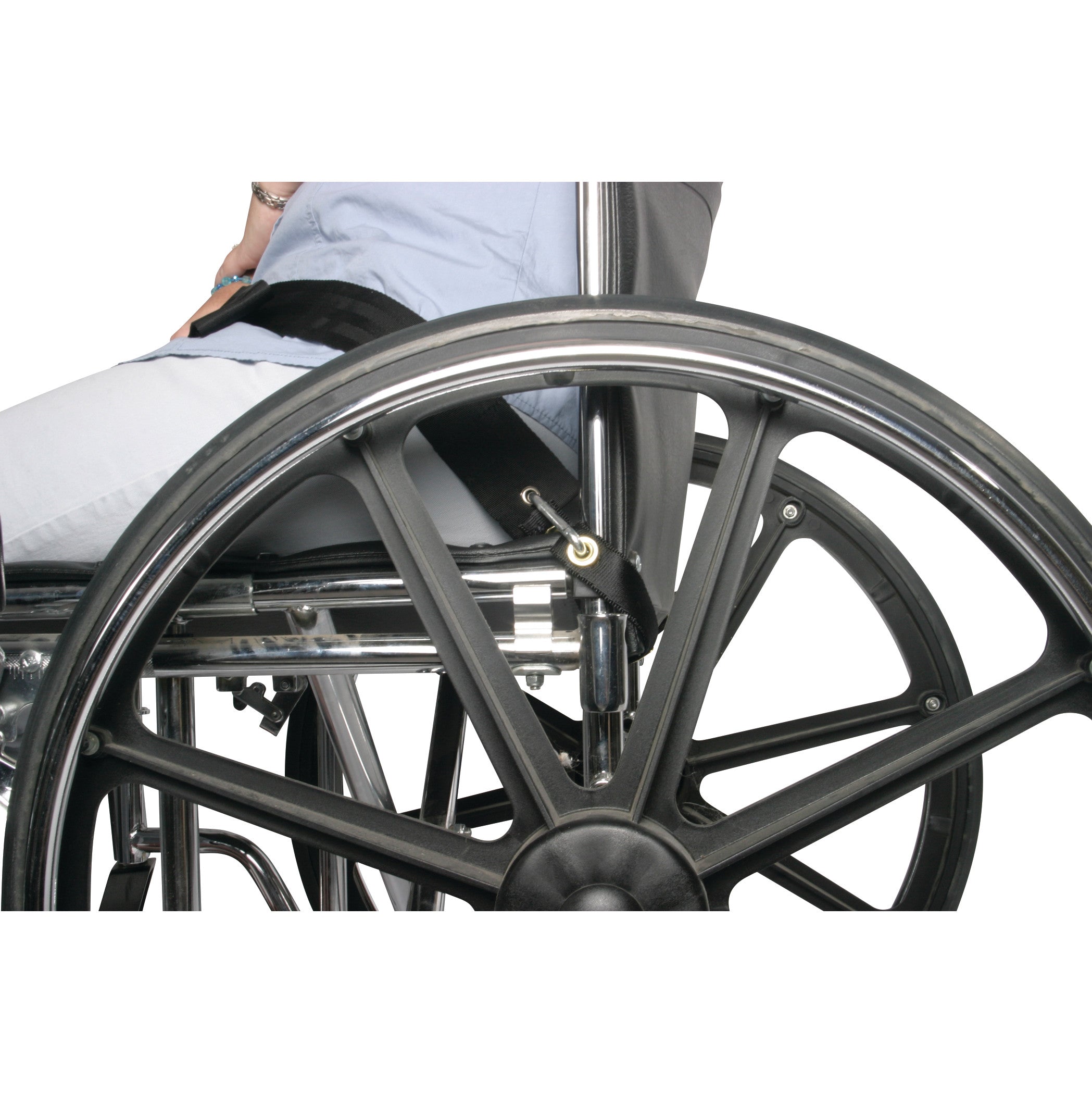 A person sits in a wheelchair with the AliMed UniLoop Seatbelt Attachment securing them. The seatbelt is connected to the frame.