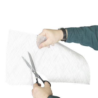 Two hands cut an Aquaplast RT Standard Perforated Sheet using scissors. The sheet has a fine mesh pattern.