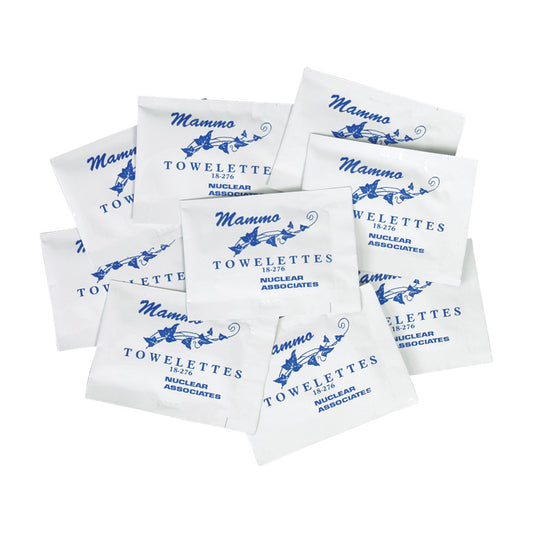 A pile of white packets labeled "Mammo Towelettes," containing Mammography Cleansing Towelettes by Nuclear Associates.