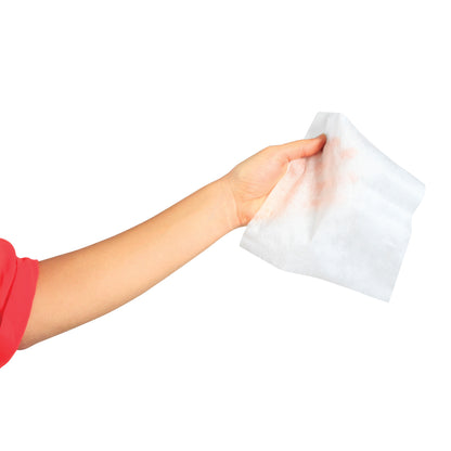 A hand holds a Mammography Cleansing Towelette, with a white cloth against a plain background.