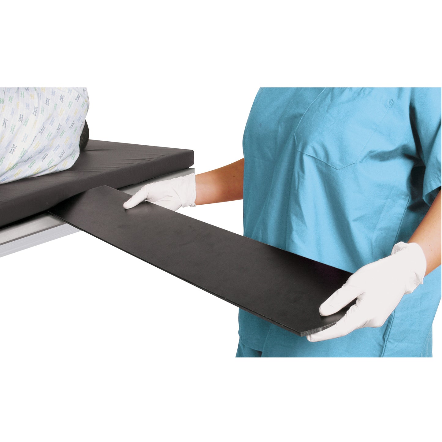 A medical professional places the AliMed Universal Armboard next to a patient's bed. They wear blue scrubs and white gloves.