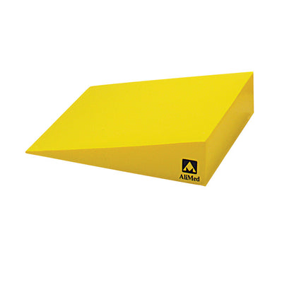 A yellow AliMed Protecta-Coat 15 Degree Wedge Positioner with a sloped surface and visible brand logo on the side.