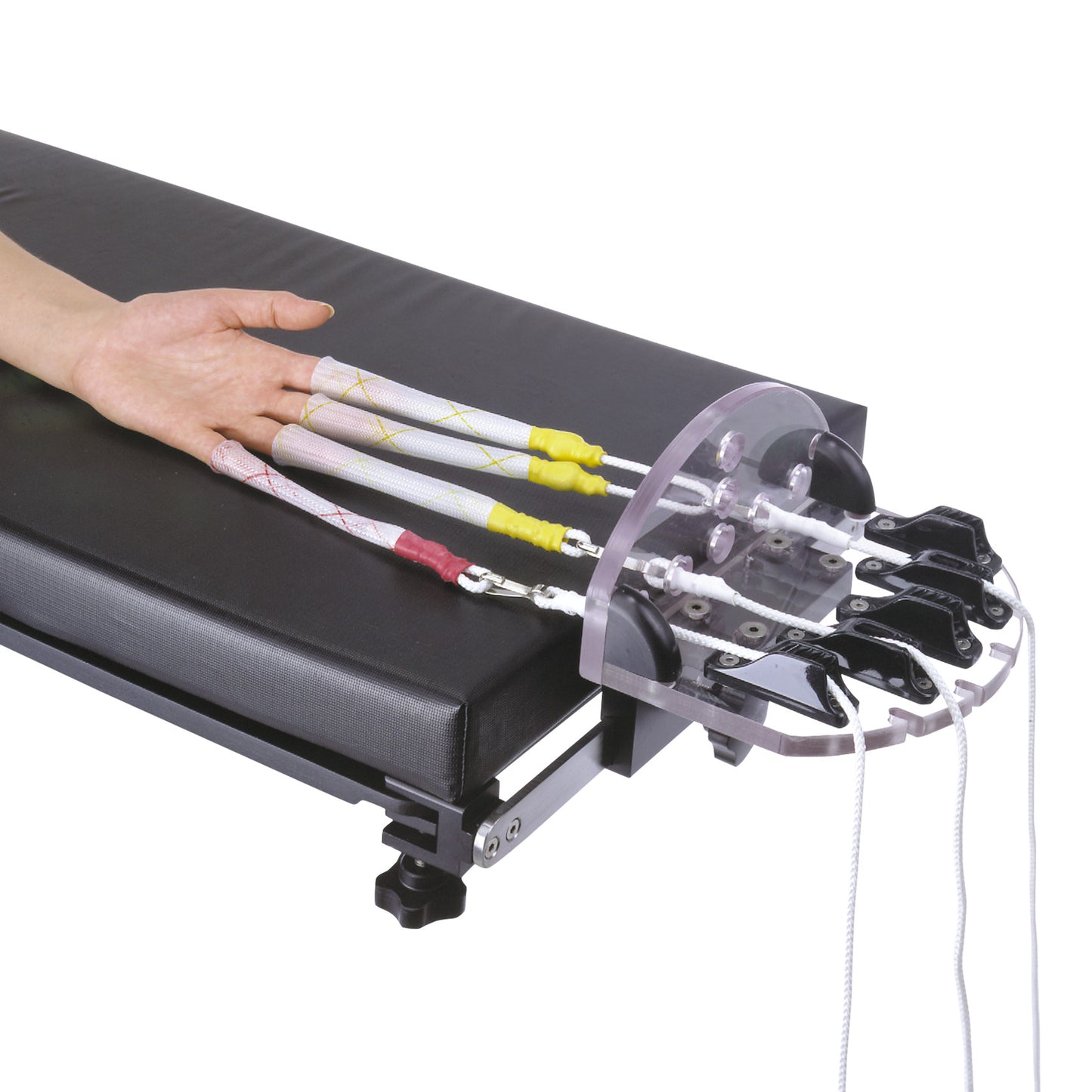The Schlein Hand Positioner secures a hand with attached rods and straps on a cushioned black platform for medical positioning.