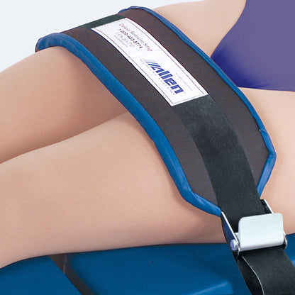 A close-up of an Allen Security Strap securing a person's thigh, featuring a black strap with a blue border and a metal buckle.