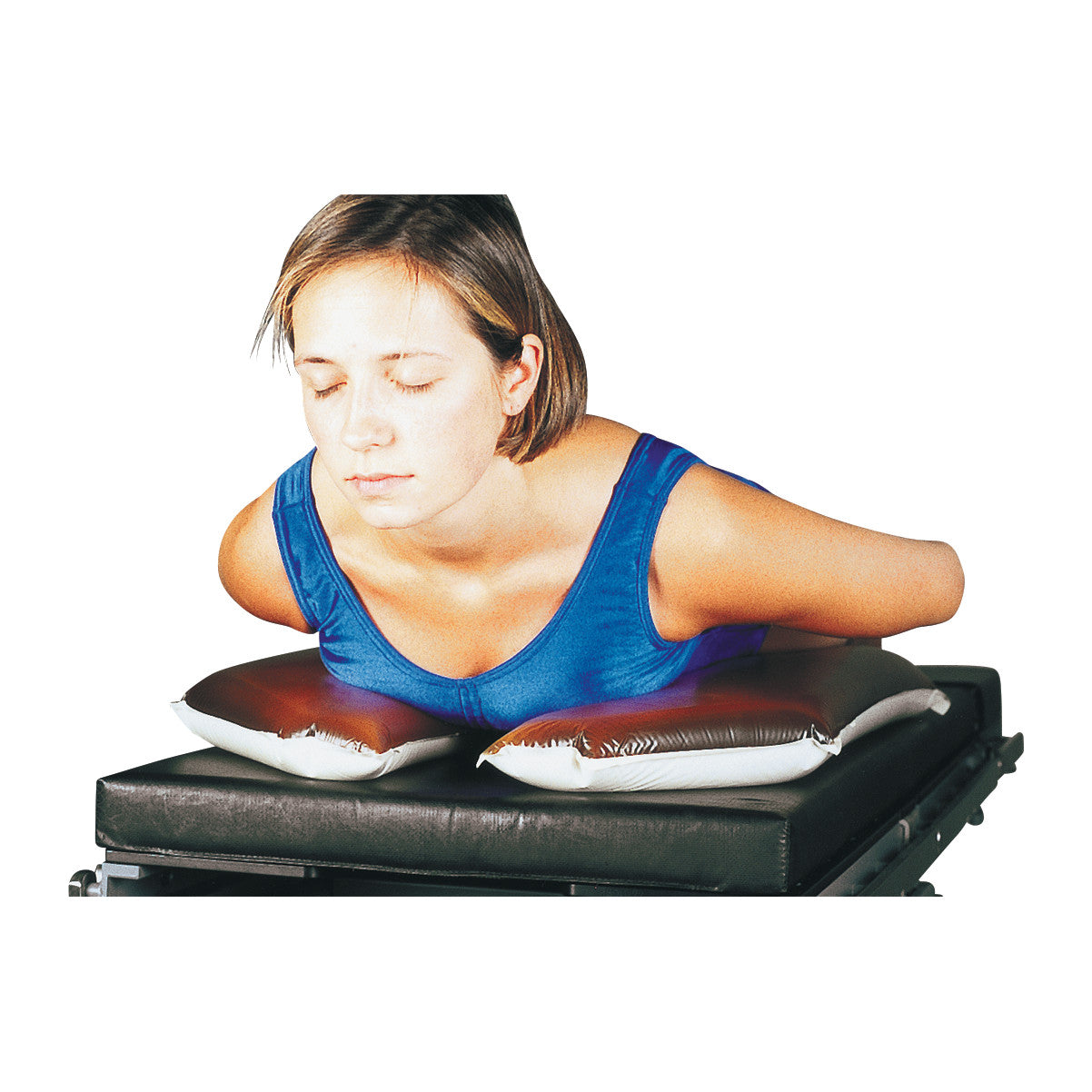 A person leans on the AliMed AliGel Chest Positioner, a cushioned support pad, placed on a flat black surface.