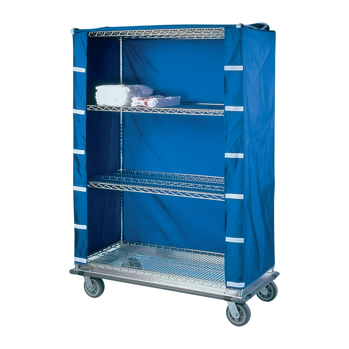 A Nexel Cart Cover on a metal shelf cart with blue fabric and wheels. A few folded towels are on the top shelf.