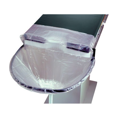 The Nonsterile Uro-Catcher Drape is attached to an examination table, designed to capture fluids with a transparent, curved surface.