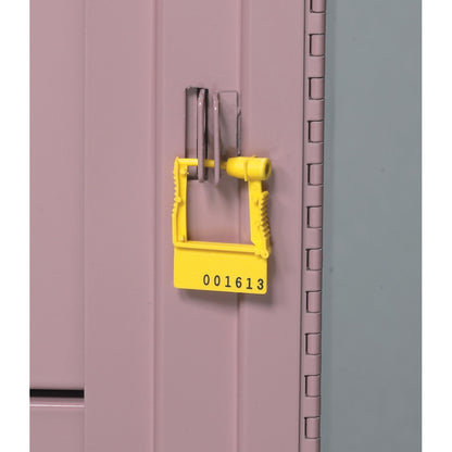 A yellow "AliMed Cart Accessory: Breakaway Lock Plastic Seals" with the number 001613 locks a pink metal cabinet.