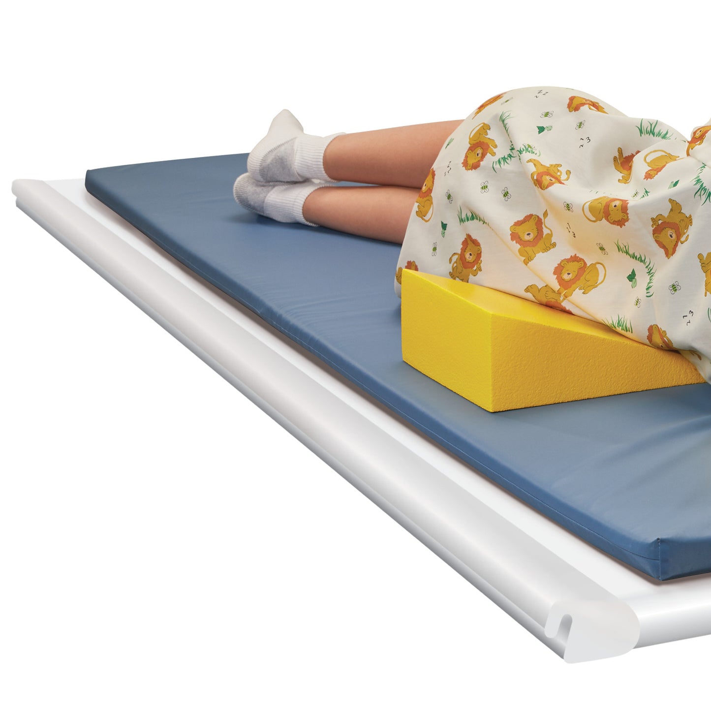 Person in lion-printed clothing lies on a mat. A yellow wedge from the AliMed Protecta-Coat Positioning Set supports their back.