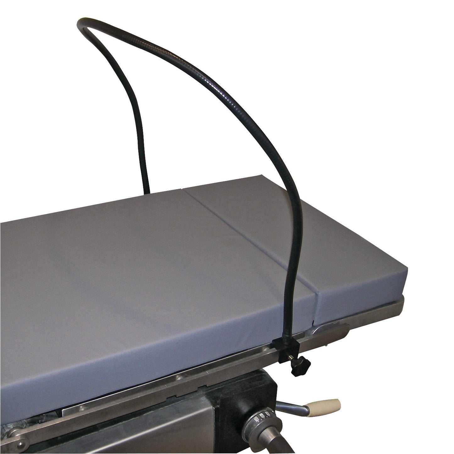 A Malleable Anesthesia Screen with Built-in Rail Clamps is attached to an operating table. It features a flexible, curved design.
