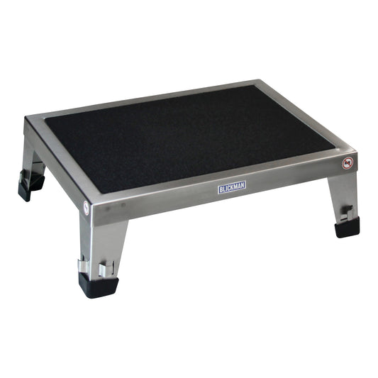 Stainless steel Blickman EZ Stacking Stool with black non-slip surface and rubber-capped legs on a white background.