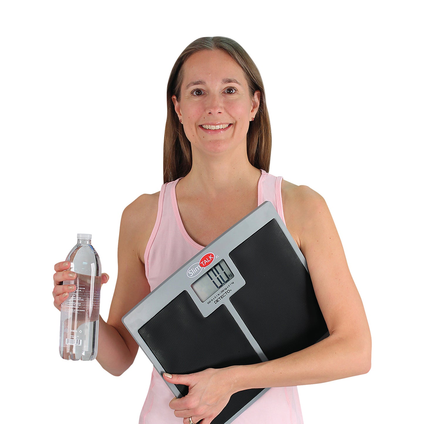 A woman holds a DETECTO SlimTalk XL Bathroom Scale and a water bottle, smiling in a pink tank top against a white background.