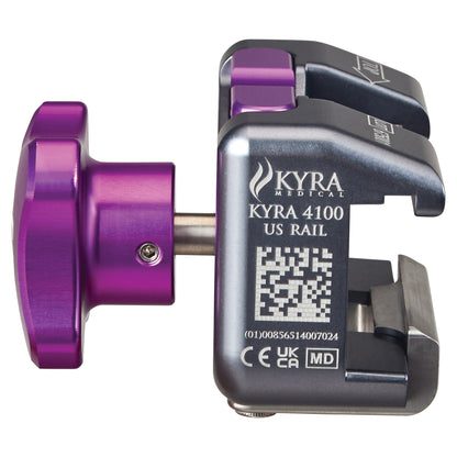 KYRA Secure-Release Clamp for Standard U.S. Surgical Table Side Rail in metallic silver and purple, featuring QR code and markings.