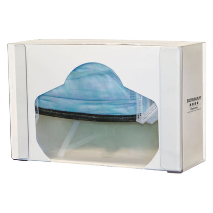 A clear container holds face masks, labeled "Bowman Single Clear PETG Face Shield Dispenser," with a mask outline on the front.