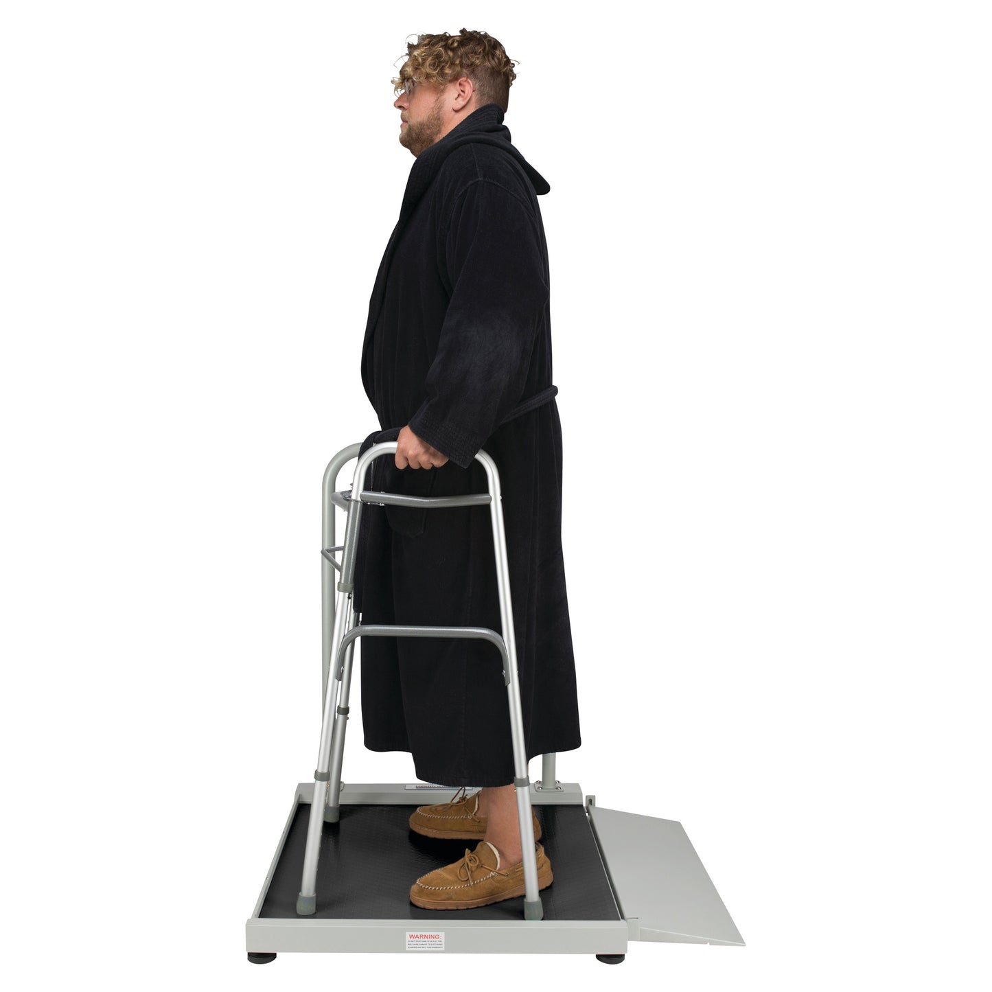 A person stands on a Health o meter Digital Wheelchair Ramp Scale, using a walker. The scale features a ramp for accessibility.