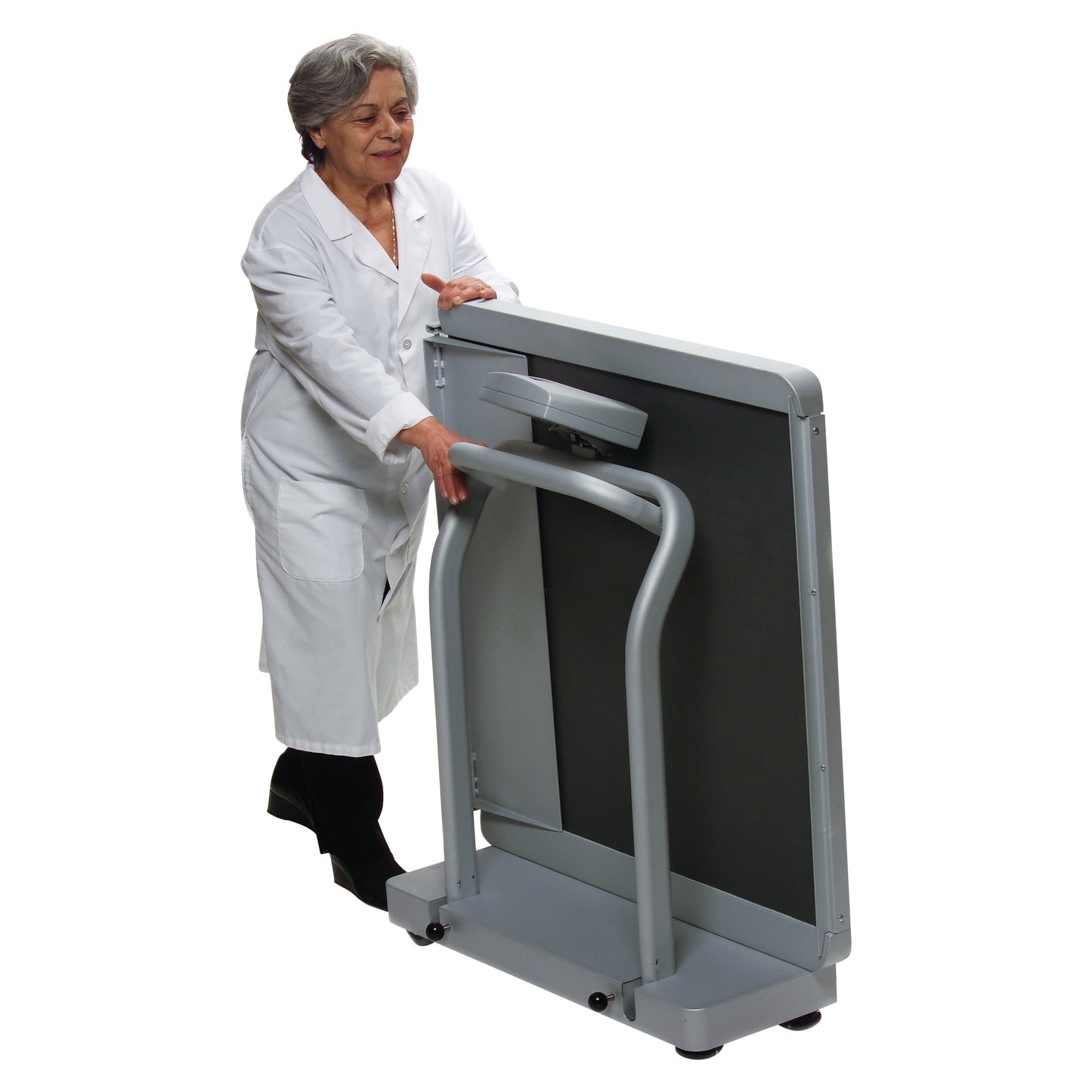 An older adult demonstrates the Health o meter Digital Wheelchair Ramp Scale, showing its foldable design for easy storage.