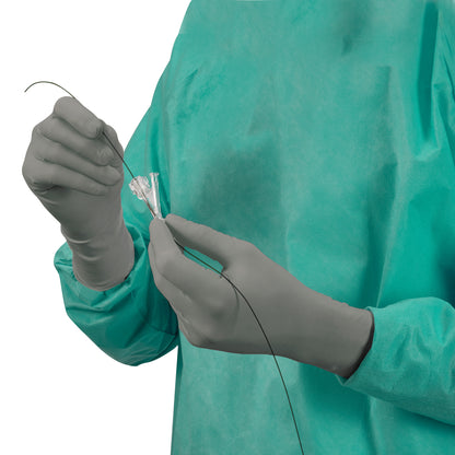 Person wearing AliMed AliGuard Radiation Attenuation Gloves and a teal medical gown, handling a thin wire device.
