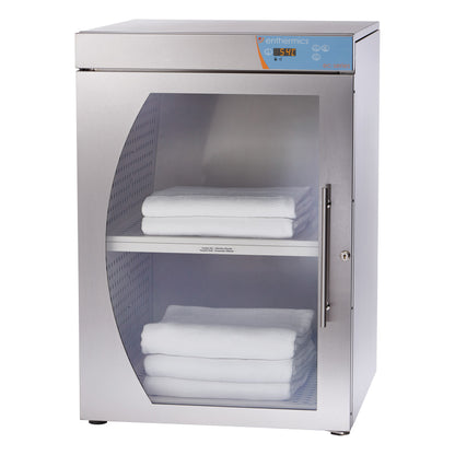 The Pedigo Enthermics Blanket Warming Cabinet has a stainless steel finish and shelves with folded white blankets inside.